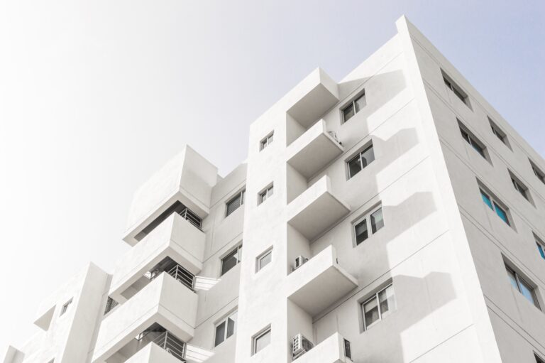 low angle shot facade white modern building blue clear sky scaled